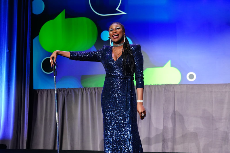 Lachi in a blue sequin naeem khan dress at disabiltyin with glam cane. Blind singer, disabled actress